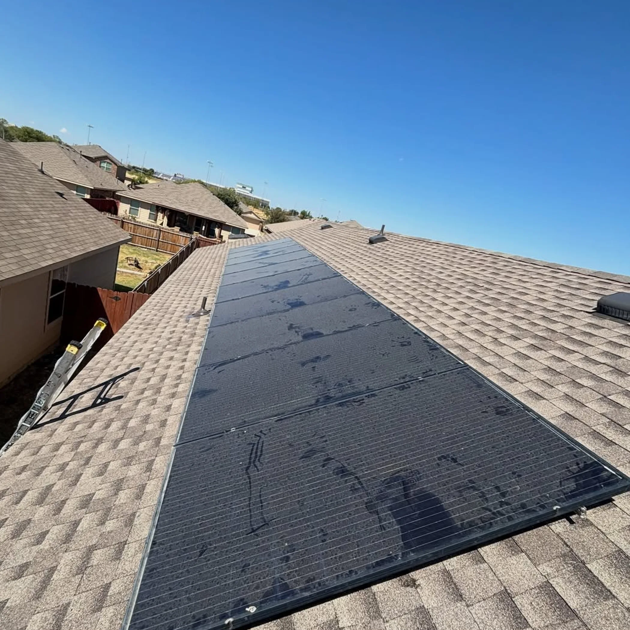 rooftop solar panels being cleaned
