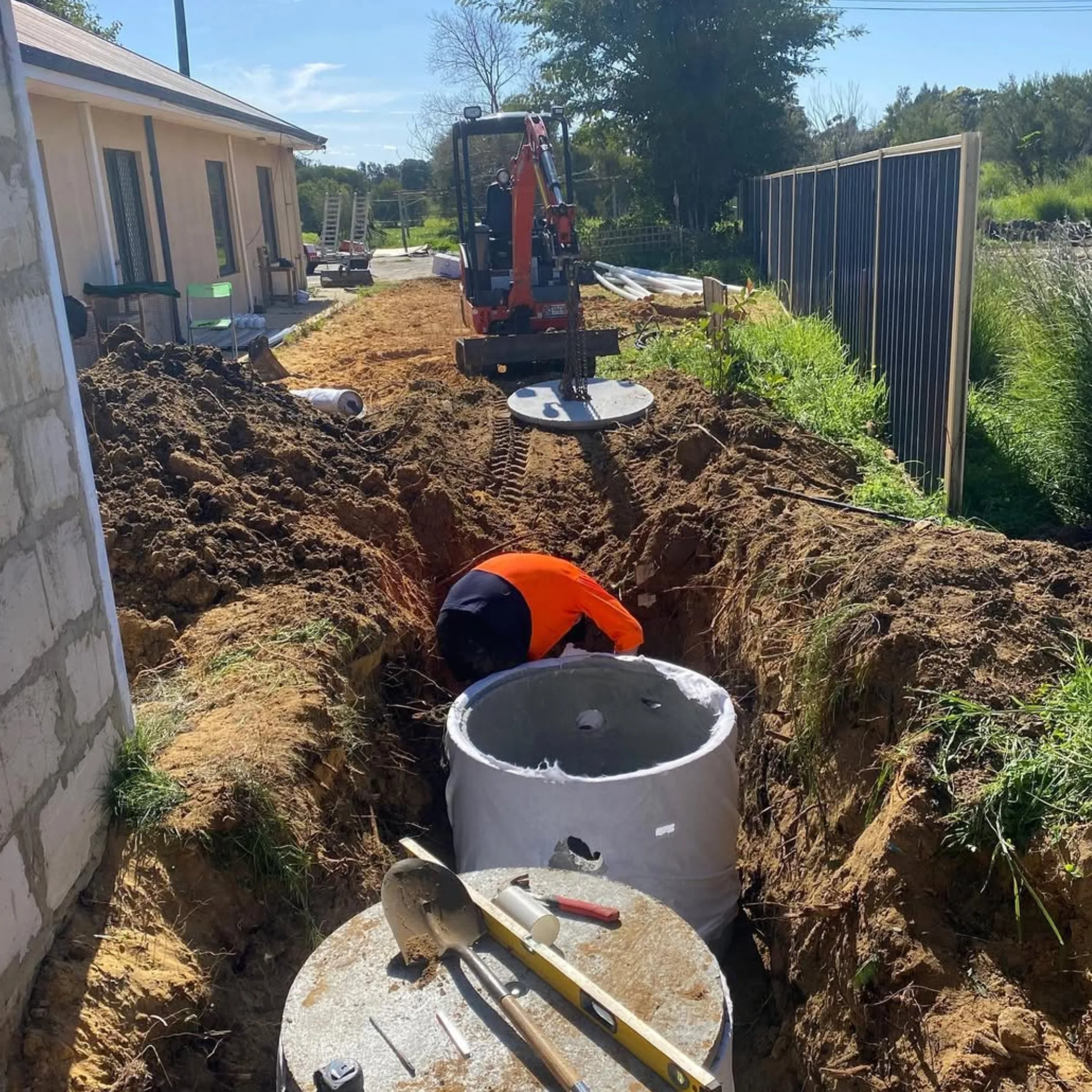 workers installing stormwater drainage infrastructure